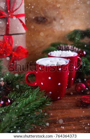 Hot chocolate with marsmallow candies Christmas card snow decor