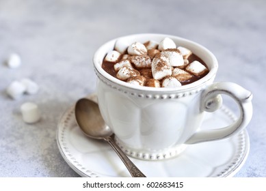 Hot Chocolate With Mini Marshmellow In A White Vintage Cup On A Light Slate,stone Or Concrete Background.