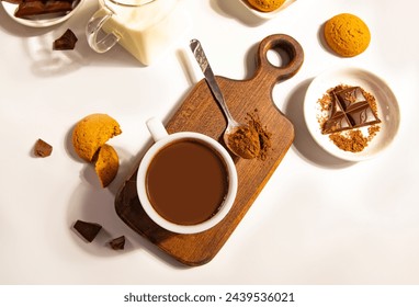 Hot chocolate with chocolate pieces and cookies. Top view. - Powered by Shutterstock