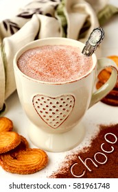 Hot chocolate with puff pastry swirl cookies and text cocoa on the cocoa powder