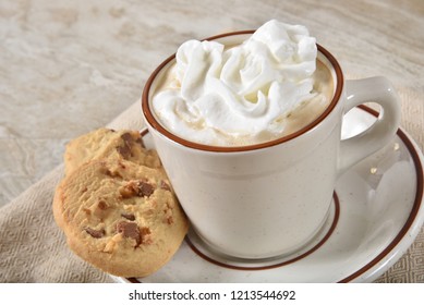 Hot Chocolate Topped With Whipped Cream Served With Gourmet Chocolate Chip Shortbread Cookies