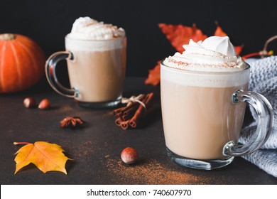 Hot Chocolate with whipped cream and cinnamon or Pumpkin Spice Latte with cream in mug on dark background. Horizontal. Autumn comfort food - Powered by Shutterstock