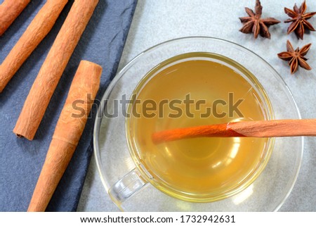 Hot cinnamon water with honey in a glass cup