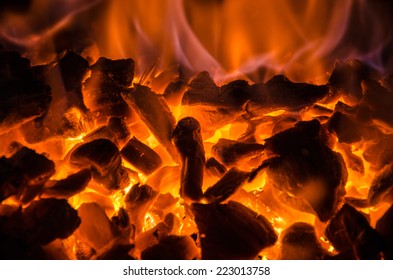 Hot coals in the fire - Shutterstock ID 223013758