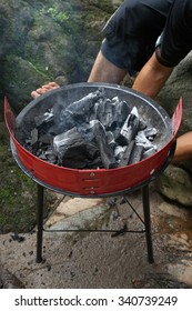 Hot Coals Glowing In A Portable BBQ