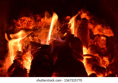 Hot coals in the stove. Red burned by heating the particles tree. - Shutterstock ID 1367325770
