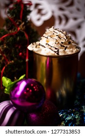 Hot Coco In Golden Cup Surrounded By Christmas Decorations