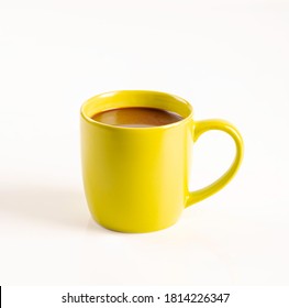 Hot Cocoa With Milk In Yellow Cup Isolated On White Background.