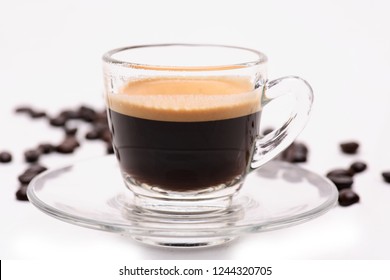 Hot coffee in clear glass,Transparent coffee cup with roasted coffee beans isolated on a white background