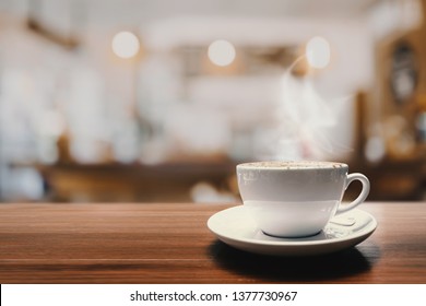 Hot Coffee Cup On Wood Table In Coffee Shop Or Cafe For Background.