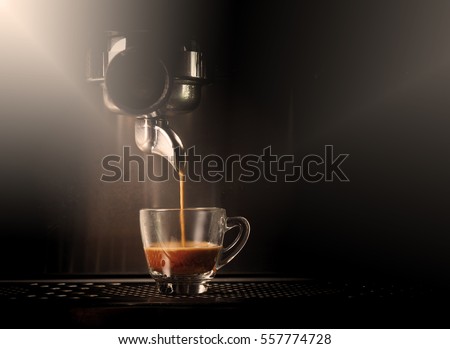 Hot coffee flow to a cup on espresso machine