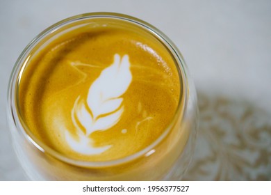 Hot Coffee Latte Art Home Mate And Milk Foam Perfect Cappuccino On A White Cup On White Background. Close Up And Macro Photography.