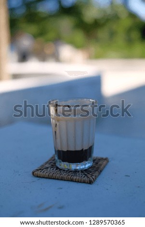 Hot coffee latte whit dark chocolate on bottom.
