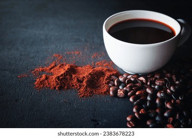 Hot coffee with coffee powder and coffee beans on a black background