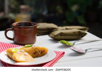 Hot coffee, tamales and vegetables. Nutrition and culture of Latin America. Outdoors.