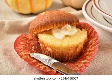 Hot Cornbread Muffin. Sliced With Melting Butter