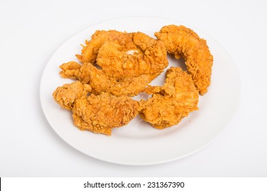 Hot, Crispy Chicken Strips On A White Plate