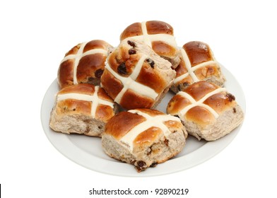 Hot cross buns on a plate isolated against white
