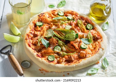 Hot And Crunchy Pizza Served With Cold Lemonade Made Of Zucchini Flower