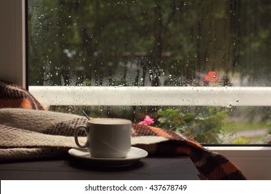 Hot Cup, Frothy Coffee In The Warm Cozy Home Atmosphere / When Behind A Window Passed A Rain