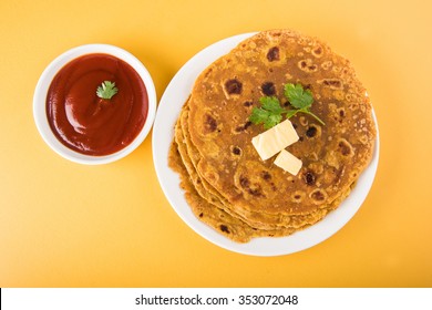 Hot Delicious Paratha With Butter And Tomato Sauce