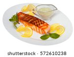 hot dish of grilled salmon on a plate with sauce