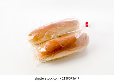 Hot Dog Bun In Plastic Bag On White Background