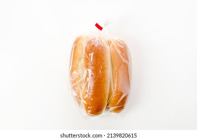 Hot Dog Bun In Plastic Bag On White Background