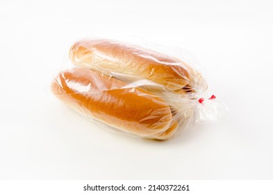 Hot Dog Bun In Plastic Bag On White Background