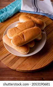 Hot Dog Buns. Bratwurst, A Pork Sausage In A Hot Dog Bun Topped With Classic Condiments Mustard, Ketchup And Sauerkraut. Classic Traditional American Baseball Game Ballpark Concession Stand Item.