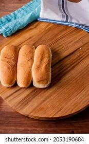 Hot Dog Buns. Bratwurst, A Pork Sausage In A Hot Dog Bun Topped With Classic Condiments Mustard, Ketchup And Sauerkraut. Classic Traditional American Baseball Game Ballpark Concession Stand Item.