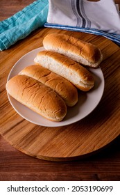 Hot Dog Buns. Bratwurst, A Pork Sausage In A Hot Dog Bun Topped With Classic Condiments Mustard, Ketchup And Sauerkraut. Classic Traditional American Baseball Game Ballpark Concession Stand Item.