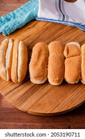 Hot Dog Buns. Bratwurst, A Pork Sausage In A Hot Dog Bun Topped With Classic Condiments Mustard, Ketchup And Sauerkraut. Classic Traditional American Baseball Game Ballpark Concession Stand Item.