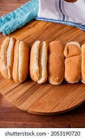 Hot Dog Buns. Bratwurst, A Pork Sausage In A Hot Dog Bun Topped With Classic Condiments Mustard, Ketchup And Sauerkraut. Classic Traditional American Baseball Game Ballpark Concession Stand Item.