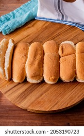 Hot Dog Buns. Bratwurst, A Pork Sausage In A Hot Dog Bun Topped With Classic Condiments Mustard, Ketchup And Sauerkraut. Classic Traditional American Baseball Game Ballpark Concession Stand Item.