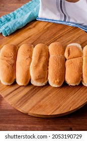 Hot Dog Buns. Bratwurst, A Pork Sausage In A Hot Dog Bun Topped With Classic Condiments Mustard, Ketchup And Sauerkraut. Classic Traditional American Baseball Game Ballpark Concession Stand Item.