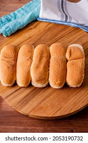 Hot Dog Buns. Bratwurst, A Pork Sausage In A Hot Dog Bun Topped With Classic Condiments Mustard, Ketchup And Sauerkraut. Classic Traditional American Baseball Game Ballpark Concession Stand Item.