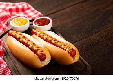 Hot dog with ketchup and yellow mustard. - Shutterstock ID 1922473676