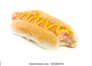 Hot Dog With Missing Bite And Mustard On A White Background