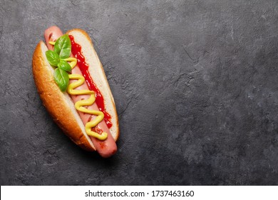 Hot Dog With Mustard And Ketchup On Stone Background. Top View With Copy Space. Flat Lay