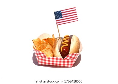 Hot Dog. Hot Dog with Mustard, Potato Chips and an American Flag. Isolated on white. Room for text. Hot Dogs are a perfect meal for any Holiday Lunch. 
 - Powered by Shutterstock
