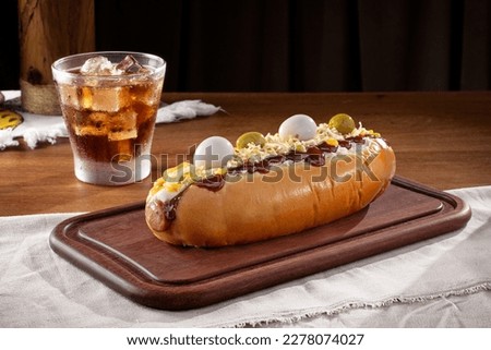 
Hot dog with quail egg, olives, straw potatoes and soda