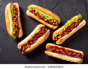 Hot dog . Traditional american fast food . Top view on wooden background - Powered by Shutterstock