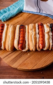 Hot Dogs. Bratwurst, A Pork Sausage In A Hot Dog Bun Topped With Classic Condiments Mustard, Ketchup And Sauerkraut. Classic Traditional American Baseball Game Ballpark Concession Stand Item.