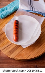 Hot Dogs. Bratwurst, A Pork Sausage In A Hot Dog Bun Topped With Classic Condiments Mustard, Ketchup And Sauerkraut. Classic Traditional American Baseball Game Ballpark Concession Stand Item.