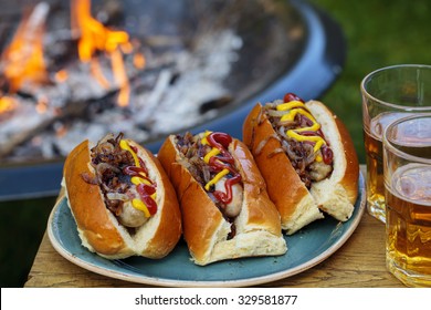 Hot dogs with the camp fire in the background