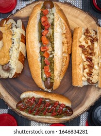 Hot Dogs With Cheese Bacon Relish Ketchup On Wooden Platter 