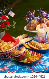 Hot Dogs, Corn And Burgers On 4th Of July Picnic In Patriotic Theme