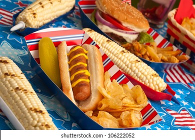 Hot Dogs, Corn And Burgers On 4th Of July Picnic In Patriotic Theme