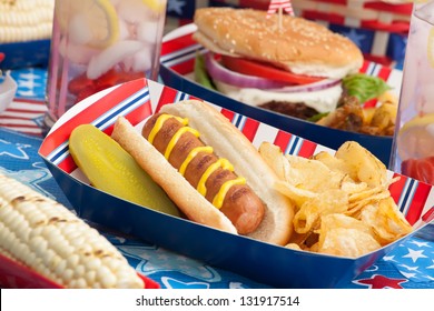 Hot dogs, corn and burgers on 4th of July picnic in patriotic theme - Powered by Shutterstock